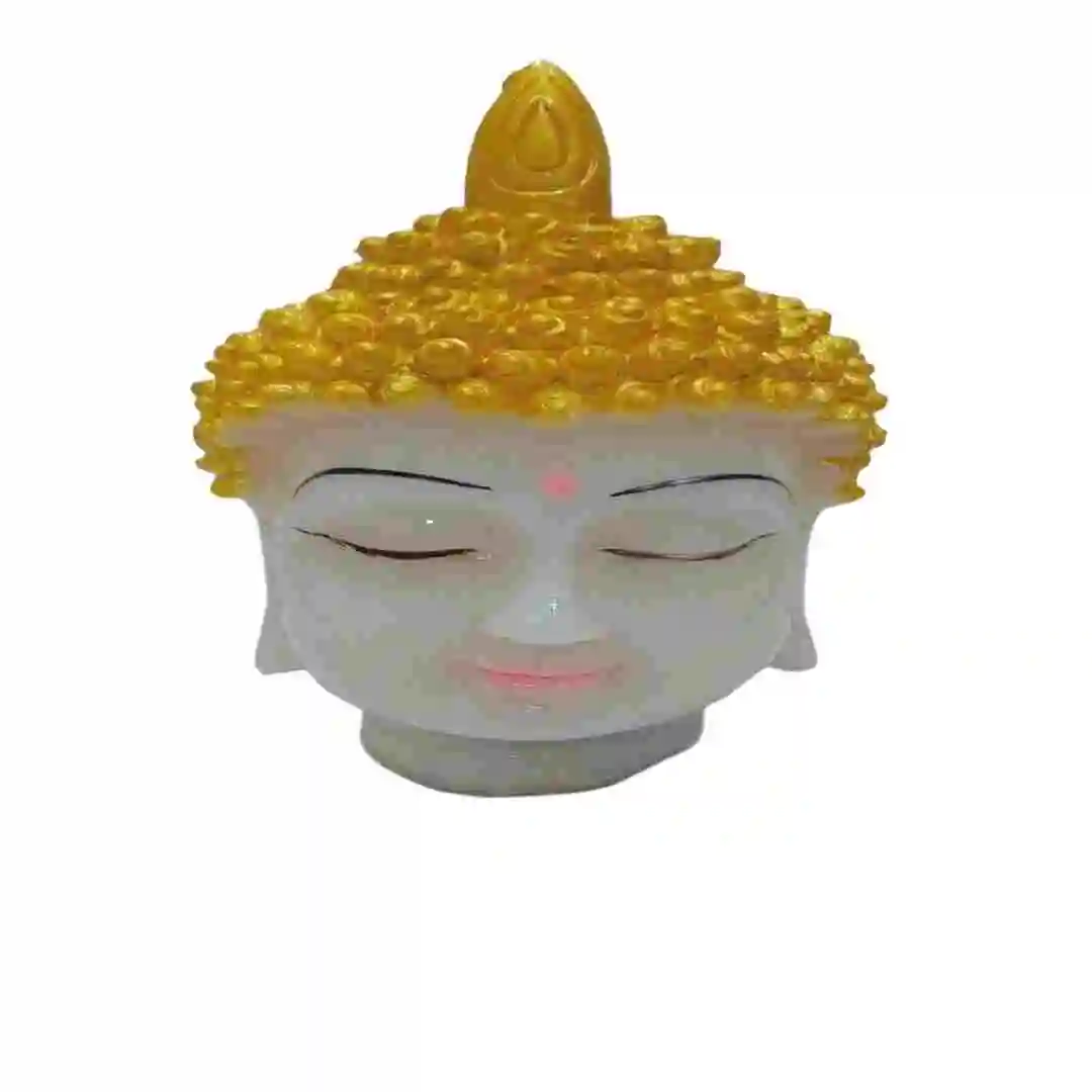 Small golden Buddha head idol with closed eyes made from marble dust for home and office decor